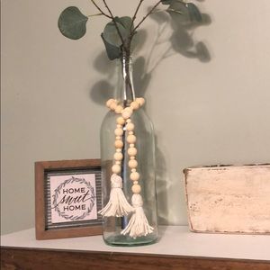 24” wood bead garland with white tassels